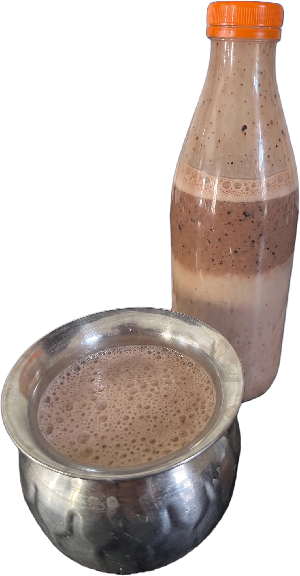 The shake poured into a steel pot beside its bottle